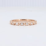 Load image into Gallery viewer, Rose gold ring featuring round diamonds in a delicate wave design, perfect for elegant stacking.