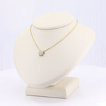 Load image into Gallery viewer, Gold chain necklace with an opal pendant, featuring a delicate starburst design. Elegant and modern style.