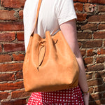 Load image into Gallery viewer, Tan Leather Tie Bucket Bag with Adjustable Strap and Yellow Hardware