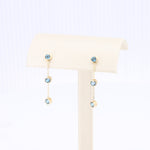 Load image into Gallery viewer, London Blue Topaz Triple Drop Earrings in Yellow Gold