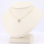 Load image into Gallery viewer, Icy Tanzanite Quatrefoil Pendant on yellow gold chain