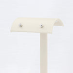 Load image into Gallery viewer, Cream jewelry display stand with silver ball accents, perfect for showcasing earrings and small accessories.