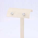 Load image into Gallery viewer, Elegant sterling silver stud earrings with round, clear cubic zirconia gemstones, featuring a classic design.