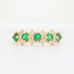 Load image into Gallery viewer, Emerald and diamond ring in gold, featuring six vibrant emeralds set in a delicate, vintage-inspired design.