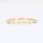 Load image into Gallery viewer, Elegant gold diamond bangle featuring five sparkling round diamonds in a unique wavy design. Perfect for layering.