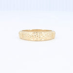 Load image into Gallery viewer, Gold floral engraved band ring, intricate design, polished finish, perfect for weddings or fashion accessories.