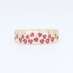 Load image into Gallery viewer, Gold ring adorned with pink rubies and sparkling white diamonds, featuring a floral design.