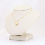 Load image into Gallery viewer, Gold monstera leaf pendant necklace with delicate chain, perfect for adding a touch of nature-inspired elegance.