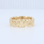 Load image into Gallery viewer, Elegant gold floral-patterned band ring, crafted from durable metal, perfect for stacking or standalone wear.