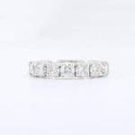 Load image into Gallery viewer, White gold eternity band ring featuring five sparkling princess-cut diamonds. Elegant and timeless style.