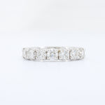 Load image into Gallery viewer, Silver eternity ring featuring radiant princess-cut diamonds set in a sleek band. Perfect for engagement or anniversary.