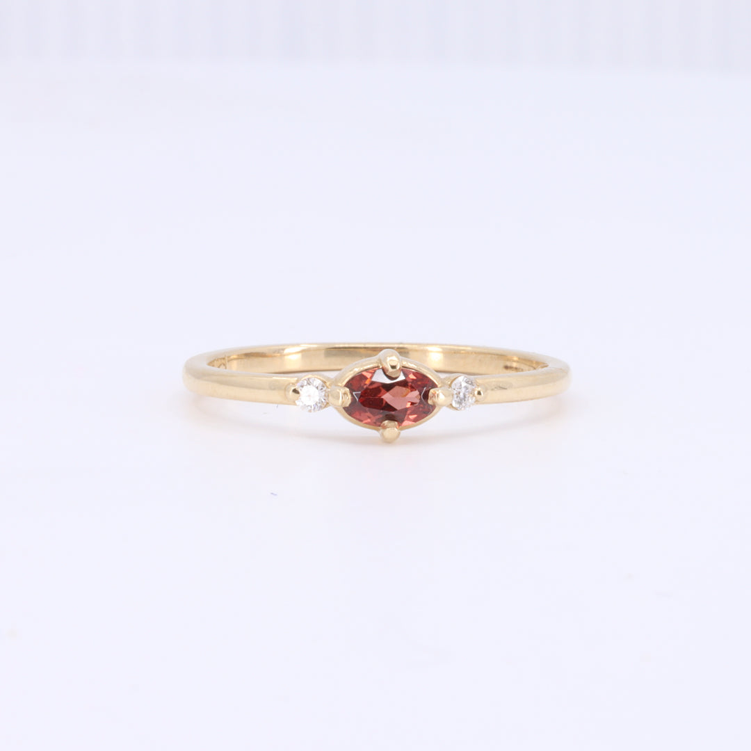 East-West Oval Garnet Ring with Diamond Trim in Yellow Gold
