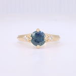 Load image into Gallery viewer, Montana sapphire and diamond ring in yellow gold with millgrain ridge.