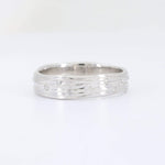 Load image into Gallery viewer, Elegant silver wedding band with wavy design and sparkling diamond accents. Perfect for modern sophistication.