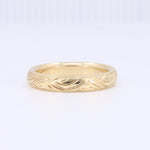 Load image into Gallery viewer, Elegant gold wave-patterned band ring, crafted in 14k yellow gold, perfect for everyday wear or special occasions.