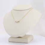 Load image into Gallery viewer, Gold pendant necklace featuring three sparkling clear crystals on a delicate chain, perfect for elegant occasions.