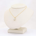 Load image into Gallery viewer, Gold chain necklace with a sparkling round cubic zirconia pendant, elegant and timeless jewelry piece.