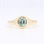 Load image into Gallery viewer, Gold ring with an oval green gemstone and diamond accents, elegant and modern design, perfect for everyday wear.