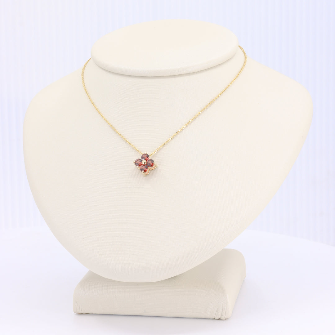 Copper Garnet Quatrefoil Pendant in Yellow Gold