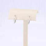 Load image into Gallery viewer, Baguette Diamond Huggie Earrings in White Gold