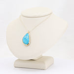 Load image into Gallery viewer, Turquoise teardrop pendant necklace in gold setting on silver chain, elegant boho jewelry for women.