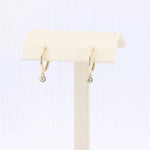 Load image into Gallery viewer, Diamond Drop Huggie Earrings in Yellow Gold