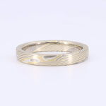 Load image into Gallery viewer, Elegant damascus steel ring with gold and silver patterns, featuring a smooth, polished finish. Ideal for unique weddings.