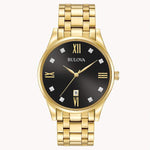 Load image into Gallery viewer, Gold Bulova watch with black dial, diamond accents, and Roman numeral markers on a sleek metal bracelet.
