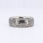 Load image into Gallery viewer, Silver damascus steel ring with intricate swirling patterns, perfect for men’s wedding bands or statement jewelry.