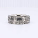 Load image into Gallery viewer, Silver damascus steel wedding band with intricate swirling patterns, perfect for modern or rustic styles.