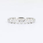 Load image into Gallery viewer, Elegant silver ring with alternating diamond accents in a chevron design, perfect for stacking or as an engagement band.
