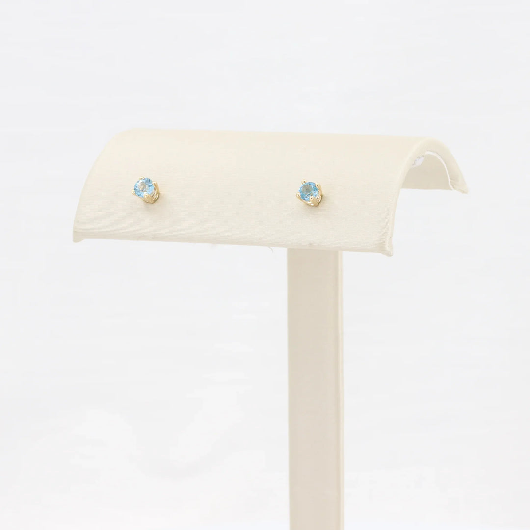 Swiss Blue Topaz Stud Earrings, 0.28cttw in 10K Yellow Gold - Kizer Cummings Jewelers