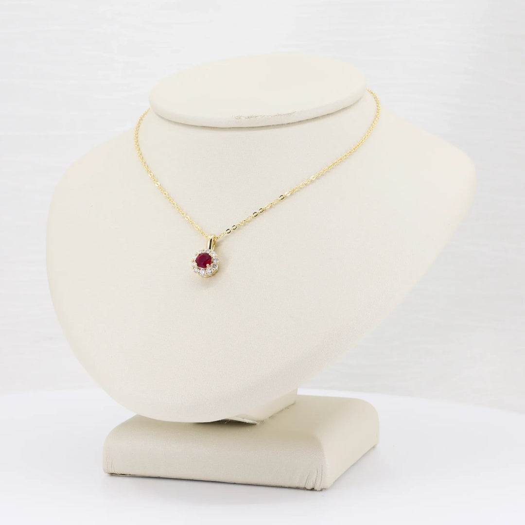 Ruby and Diamond Halo Pendant, 0.32ct Ruby with 0.18cttw Diamond Halo in 14K Yellow Gold, 18 inch Chain - Kizer Cummings Jewelers