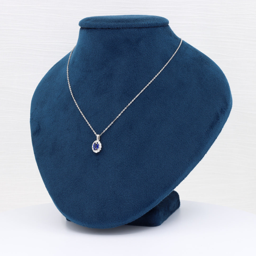 Sapphire and Diamond Halo Pendant, 0.57ct Sapphire and 0.21cttw Diamonds in 14K Yellow Gold, 18 inch Chain