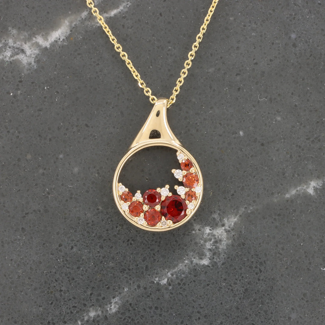 Garnet and Diamond Cluster Circle Pendant, 0.50cttw Garnet with 0.04cttw Diamond in 14K Yellow Gold, 18 inch Chain - Kizer Cummings Jewelers