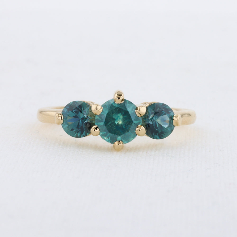 Three Stone Montana Sapphire Ring in Yellow Gold