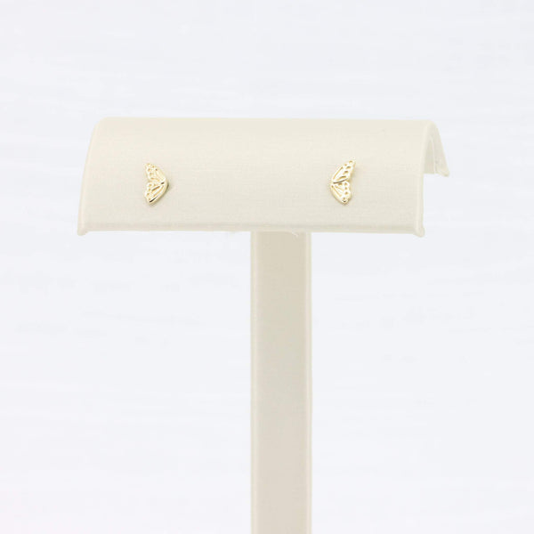 Gold butterfly stud earrings with intricate detailing, perfect for adding a delicate touch to any outfit.