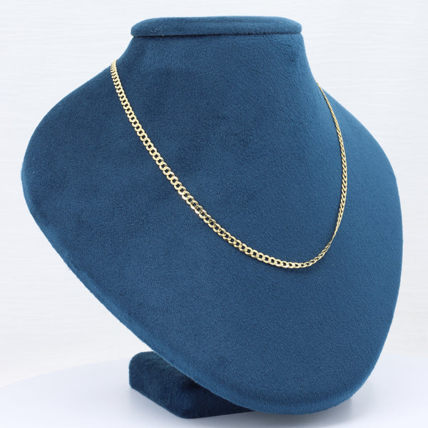 Elegant gold chain necklace displayed on a blue velvet bust, perfect for adding sophistication to any outfit.