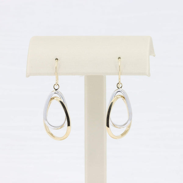 Gold and silver double-loop drop earrings in a modern design, crafted from durable metal. Perfect for any occasion.