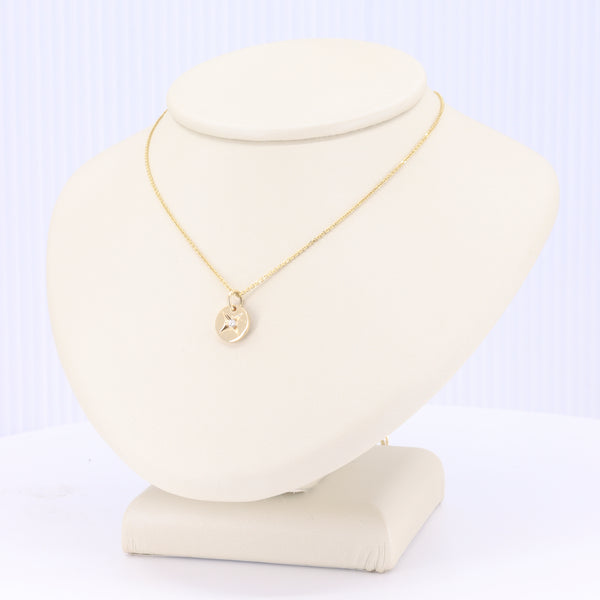 Star Set Diamond Circle Pendant on yellow gold chain, 18-inch length