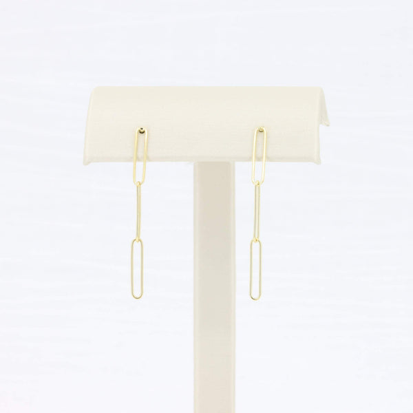 Gold paperclip dangle earrings, minimalist design, lightweight metal, perfect for everyday wear.