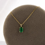 Load image into Gallery viewer, Emerald-Cut Emerald Solitaire Pendant in 14K Yellow Gold
