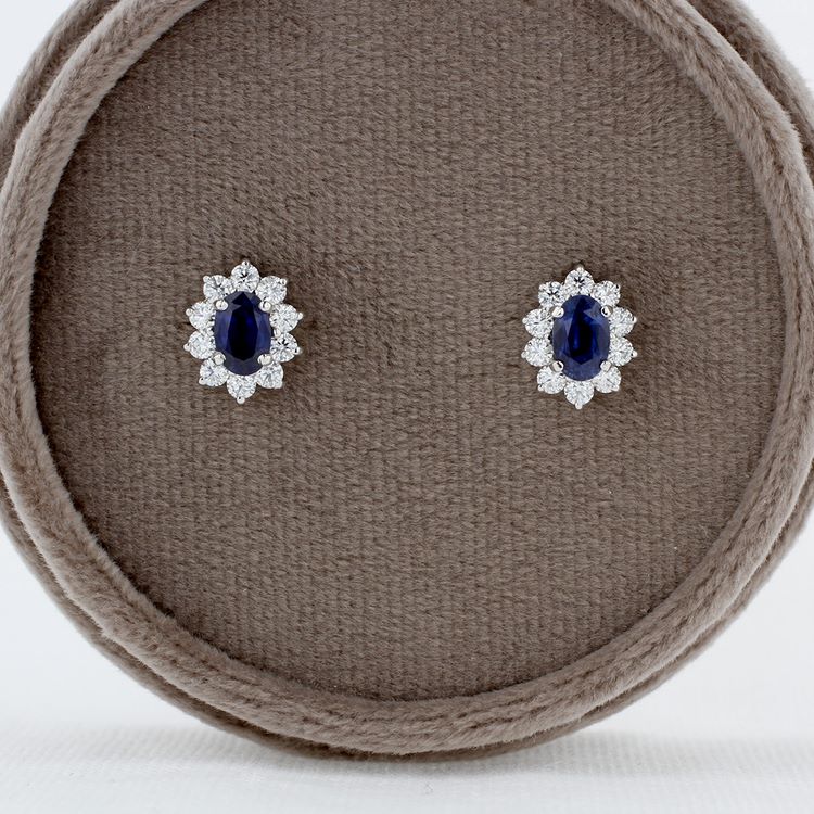 Oval Blue Sapphire and Diamond Halo Stud Earrings in White Gold