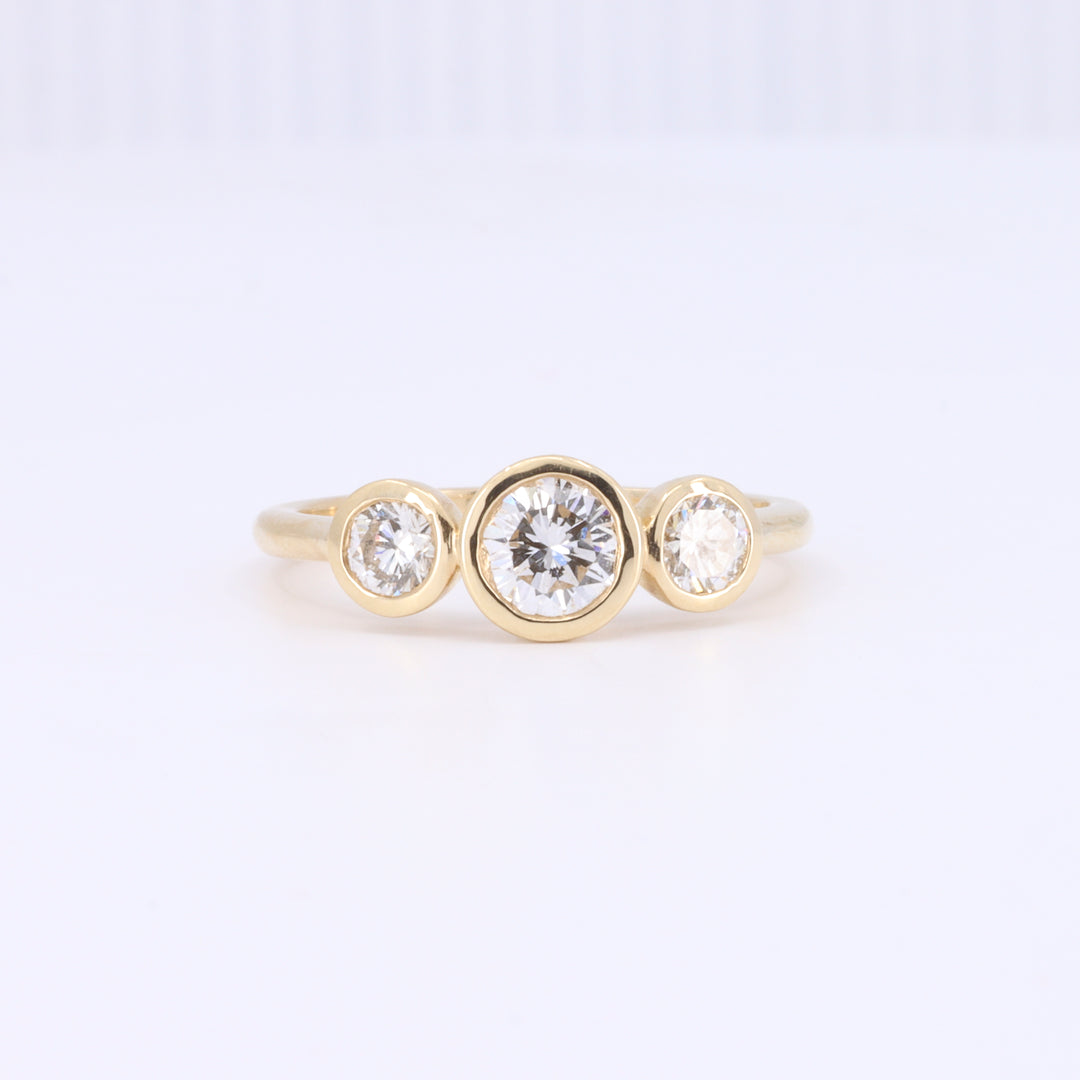 Bezel Set Three Stone Ring in Yellow Gold