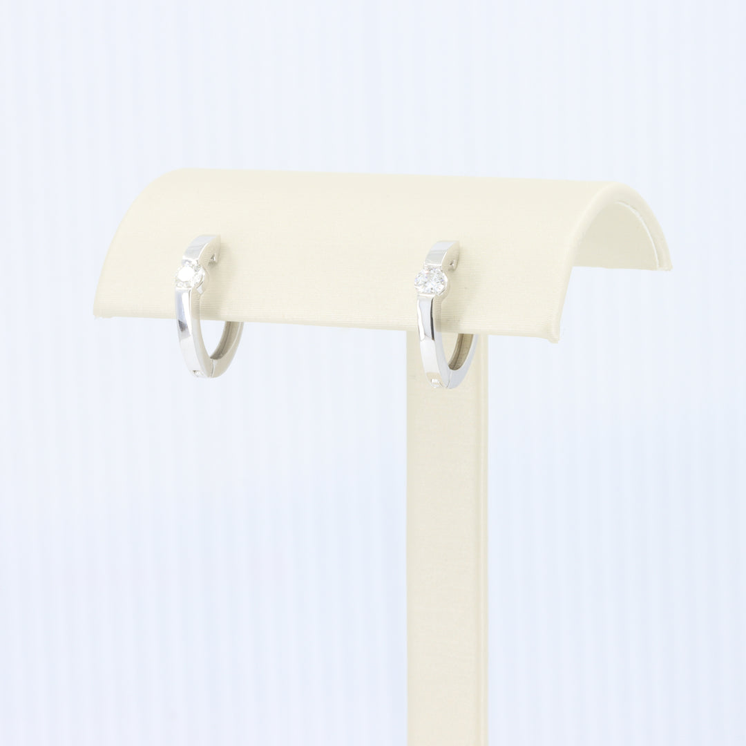 Half Bezel Diamond Huggie Earrings in White Gold