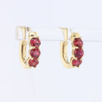 Load image into Gallery viewer, Ruby Huggie Earrings in Yellow Gold
