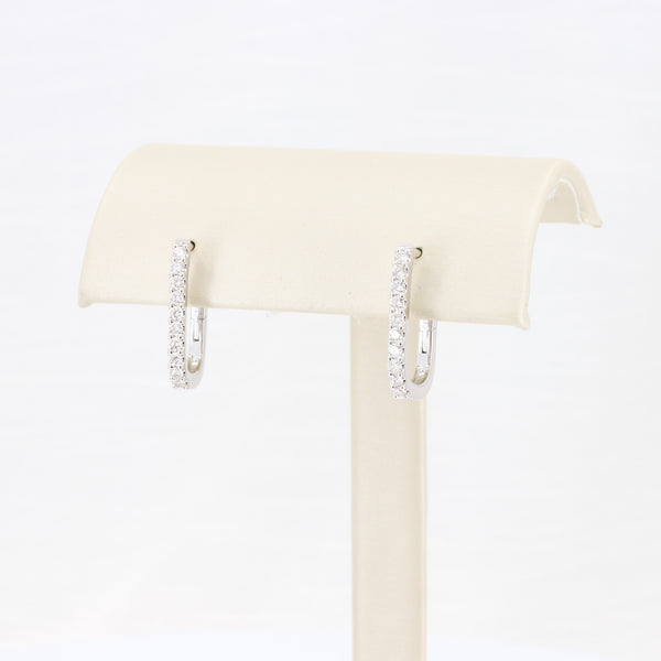 Silver hoop earrings with sparkling clear crystals, stylish and elegant, perfect for any occasion.