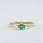 Load image into Gallery viewer, East-West Oval Emerald Ring with Diamond Trim in Yellow Gold
