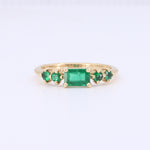 Load image into Gallery viewer, East-West Emerald-cut Emerald Ring in Yellow Gold
