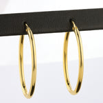 Load image into Gallery viewer, Elongated Oval Hoop Earrings in Yellow Gold